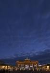 A dramatic sky above the Brandenburger Tor at blue hour in the city of Berlin, Germany, Europe.