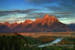 Snake River in the foreground while the tops of the Teton Range are caught in the sunrise light in Wyoming, USA.
