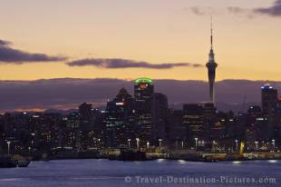The sun sets in dramatic style over the city of Auckland as dusk takes over at the end of the day on the North Island of New Zealand.