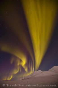 Solar energy lights up the night sky along the Dempster Highway in the Yukon Territory, Canada.