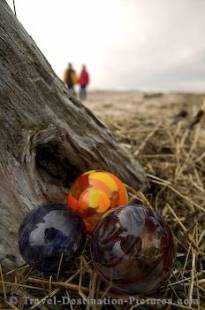 A pile of colourful glass floats on the beach in Lincoln City along the coast of Oregon, USA.